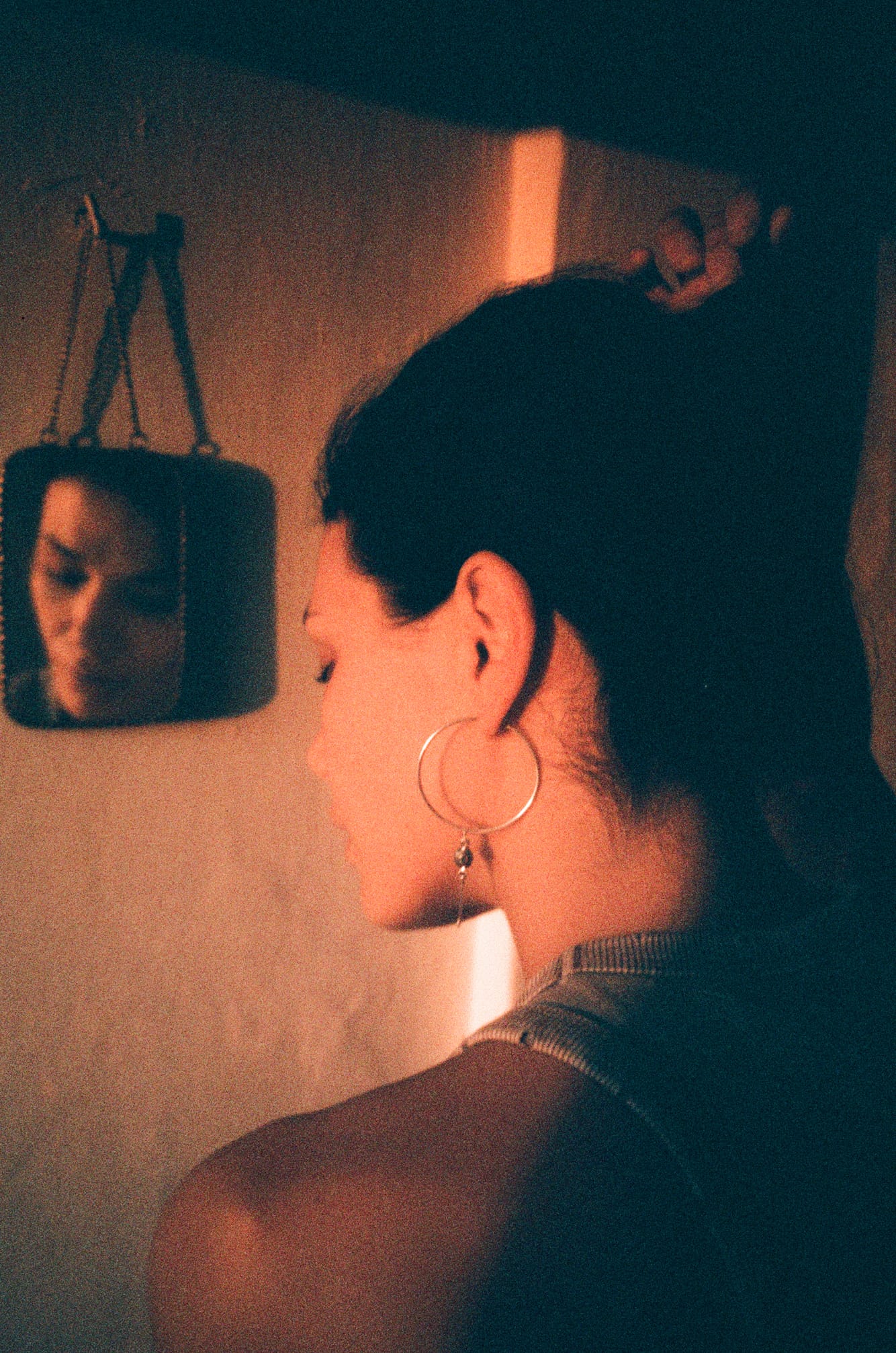 Warm portrait wearing Mukani hoop earrings.